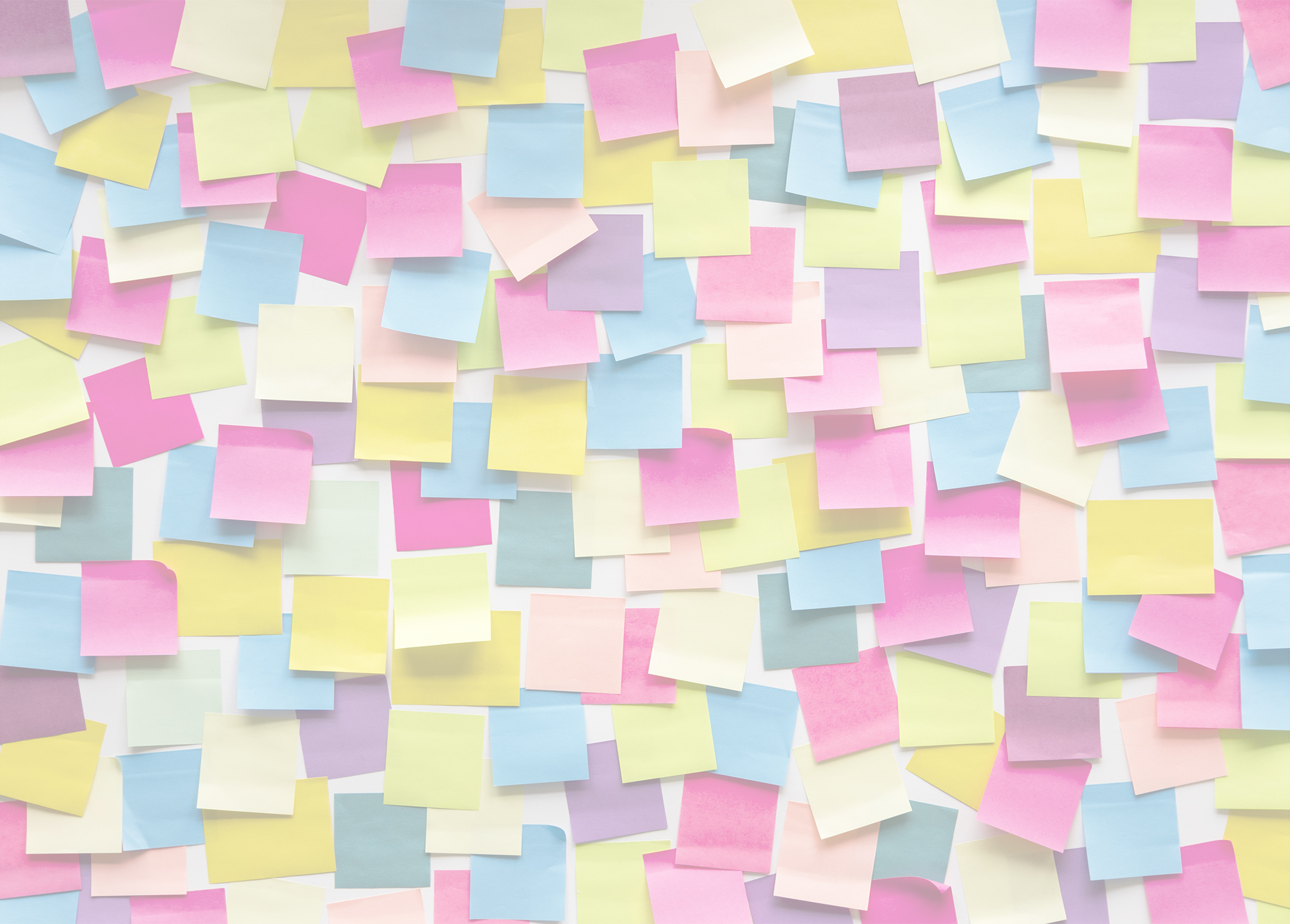 A wall covered in colorful Post-it notes